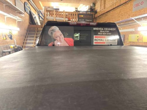 Rear window graphic on a pickup truck featuring realtor Brenda Kennedy’s photo, contact information, and Royal LePage branding.