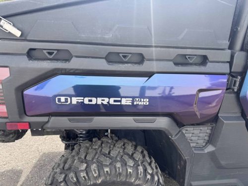 Close-up of the rear side panel on a wrapped CFMOTO QFORCE side-by-side ATV showing blue and purple colour-shifting vinyl.