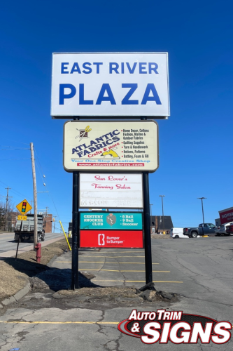 exterior sign for a business, Easy River Plaza
