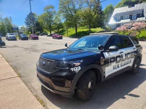 Front angle view of a New Glasgow Police SUV featuring custom vehicle graphics and identification markings.
