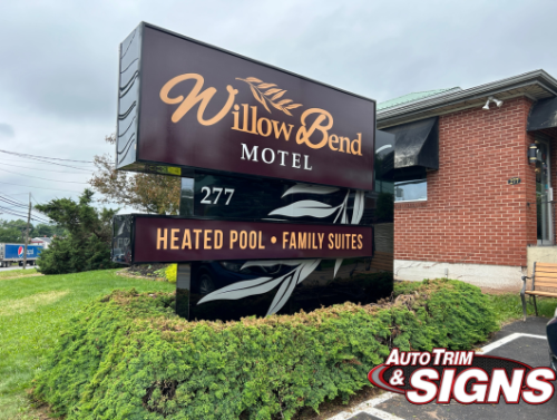 Will Bend Motel A stylish new sign for Willow Bend Motel located at 277 Willow Street. The sign features the motel's name in elegant lettering, along with highlights of amenities such as a heated pool and family suites