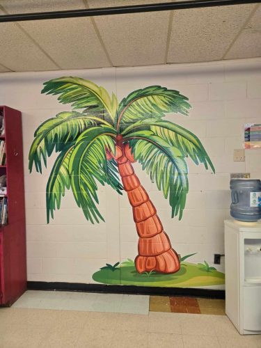 Bright, colorful palm tree wall decal inspired by Chicka Chicka Boom Boom, applied to a classroom wall.