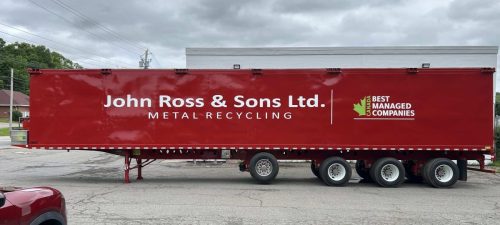 Red transport trailer with large white John Ross  Sons Ltd. Metal Recycling lettering and Canada’s Best Managed Companies logo.