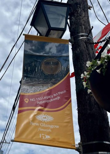 Commemorative banner featuring the NG 150 Legacy Art Piece titled Amasipukwejk, created to honor New Glasgow’s Indigenous heritage.