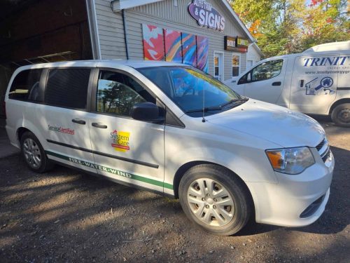 System Care service van with custom vinyl lettering and stripe graphics, installed by Auto Trim  Signs in New Glasgow, Nova Scotia.